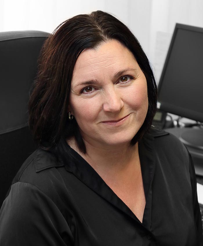 portrait of happy young woman at her desk in a cre 2023 11 27 05 23 45 utc